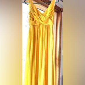 Sunflower yellow bridesmaid’s dress.